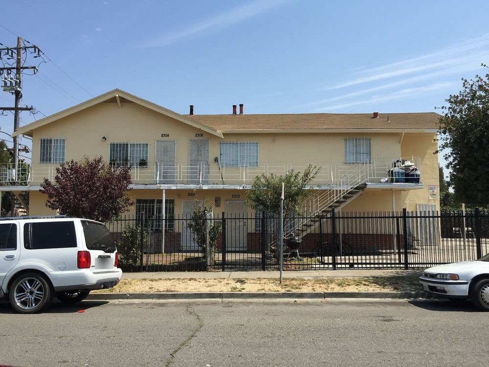 Elmhurst fourplex with a gated yard