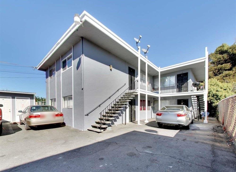Two-story Elmhurst apartment building with parking