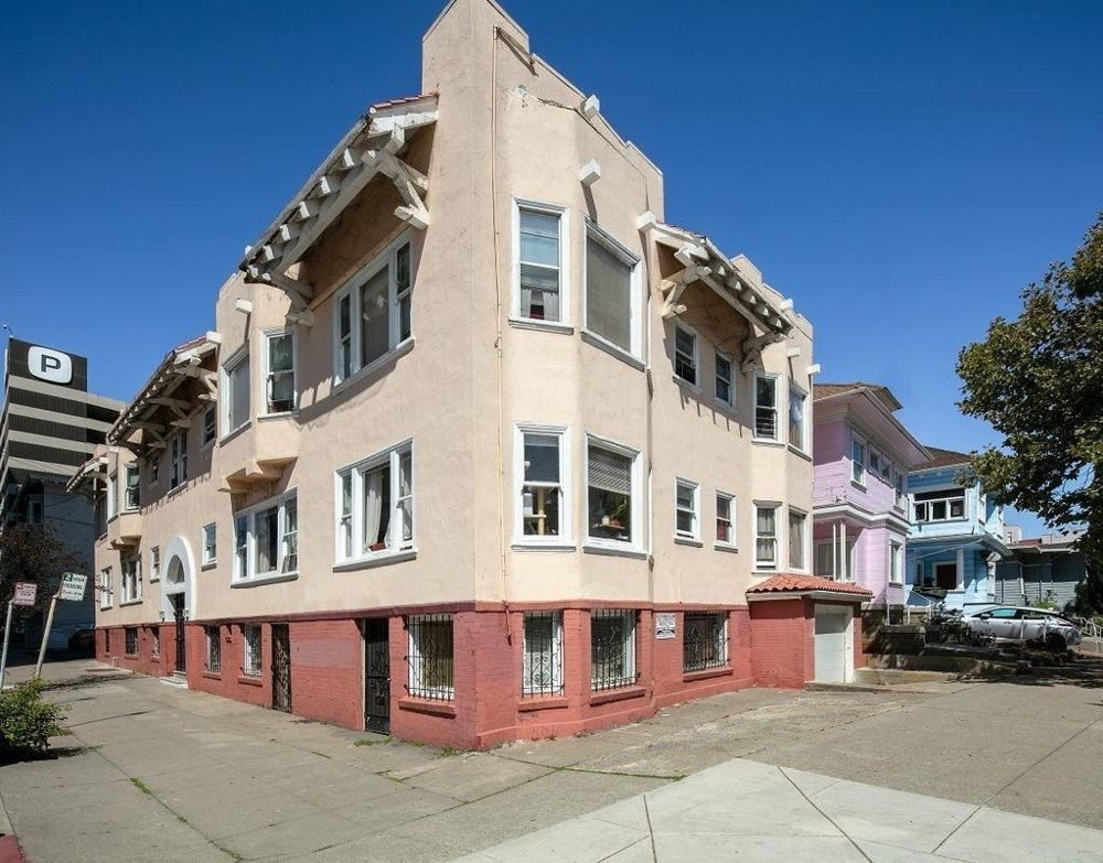 Uptown Oakland corner apartment building