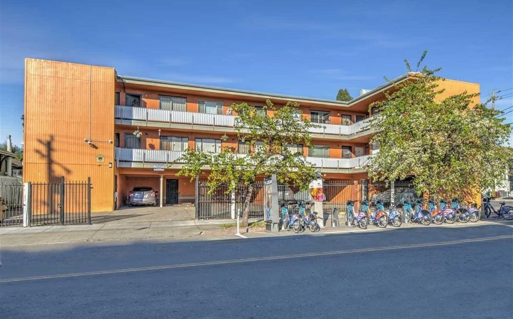 Three-story West Oakland apartment building
